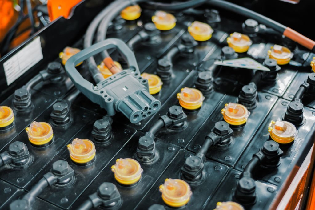 Powerful rechargeable battery forklift. On the surface of the battery is an electrical connector.